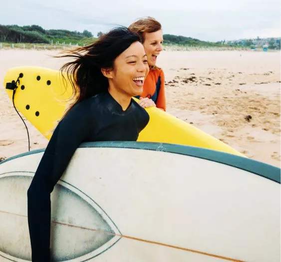 women with surfboards